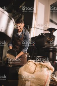 Normal man roasting coffee.